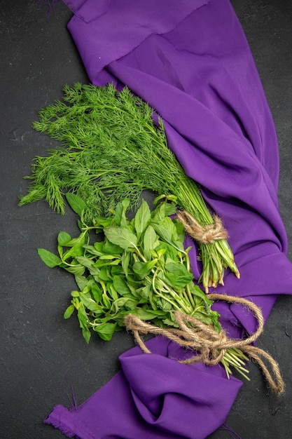 greens a bunch of greens on the tablecloth