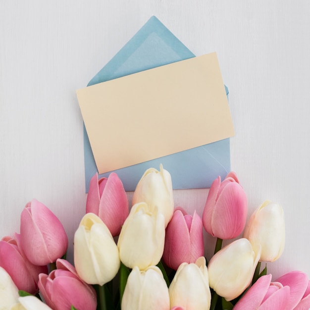 Free photo greeting card with bouquet of tulips