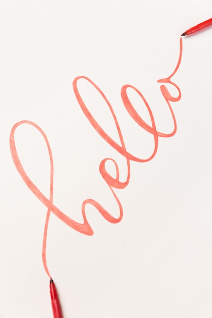 Greeting phrase handwritten with orange marker