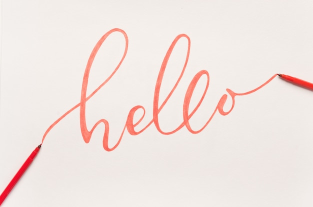 Greeting phrase handwritten with orange marker