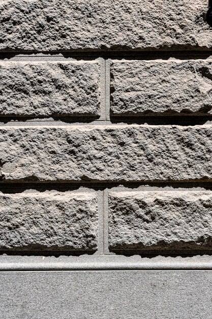 Grey cement brick wall outdoors background