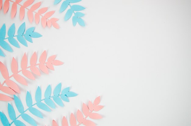 Grey copy space background with pink and blue foliage
