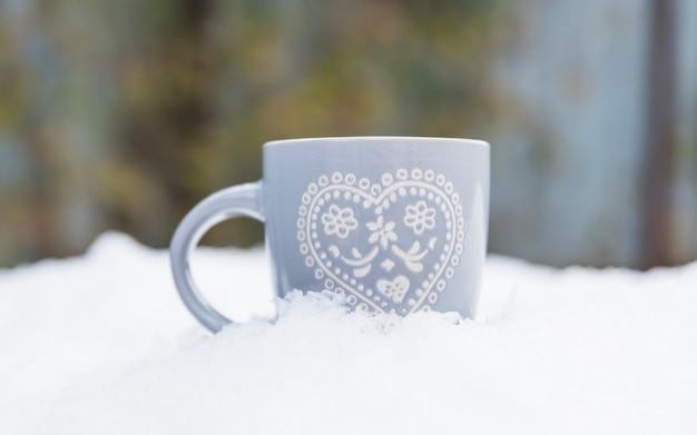 Grey cup on snow