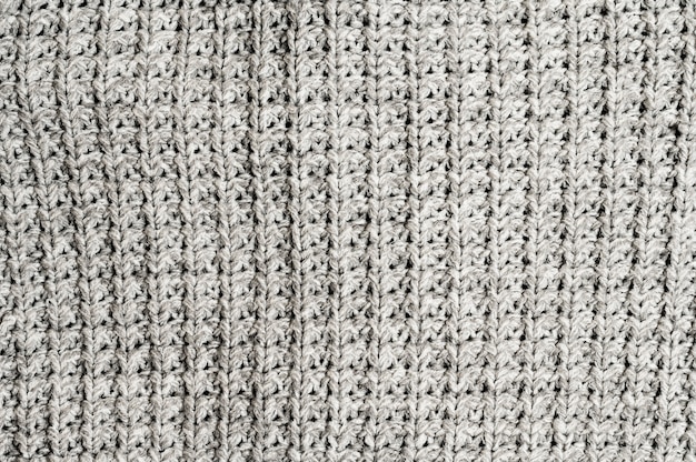 Free photo grey knitted fabric background