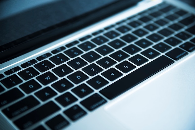 Grey laptop keyboard close up