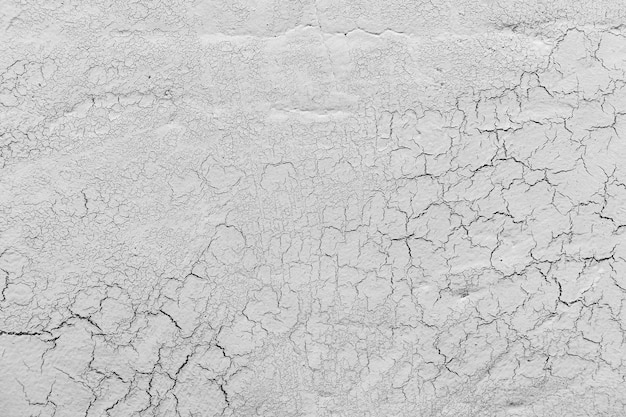 Free photo grey lime plaster with cracks background