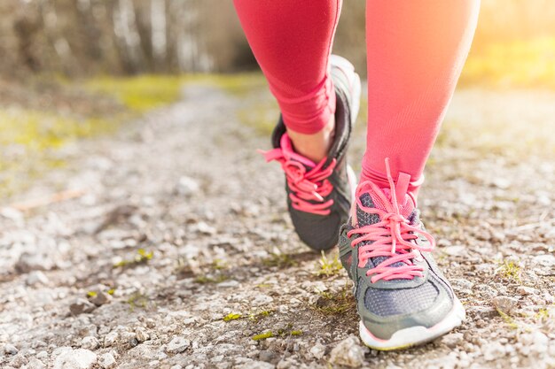 Grey and pink sneakers on the ground