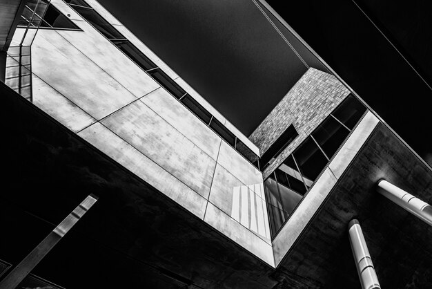 Greyscale low angle shot of a building with cool design