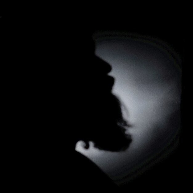 Greyscale shot of the silhouette of a beard