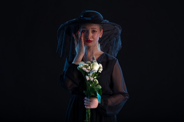 Grieving Female Dressed In Black With Flowers On Black Isolated Desk Death Funeral