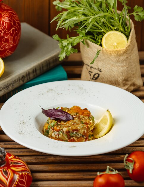 grilled aubergine salad served with lemon slice