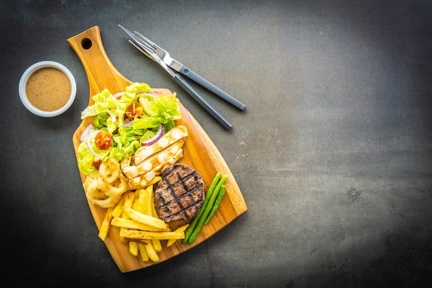 Grilled beef meat steak with french fries sauce 