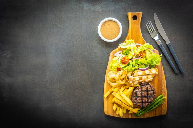 Grilled beef meat steak with french fries sauce 
