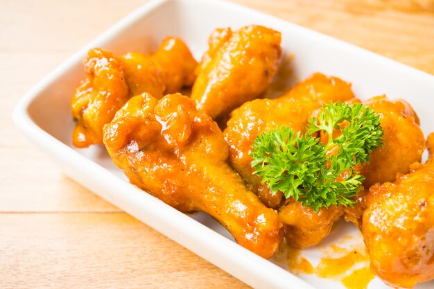 Grilled buffalo wings in white plate