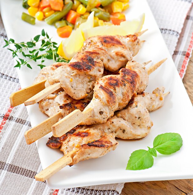 grilled chicken on bamboo skewers