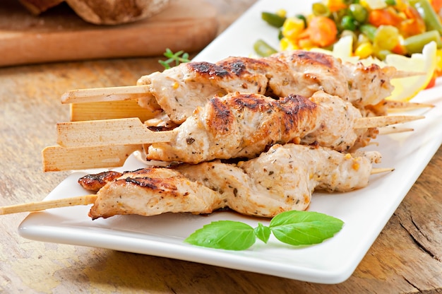 grilled chicken on bamboo skewers