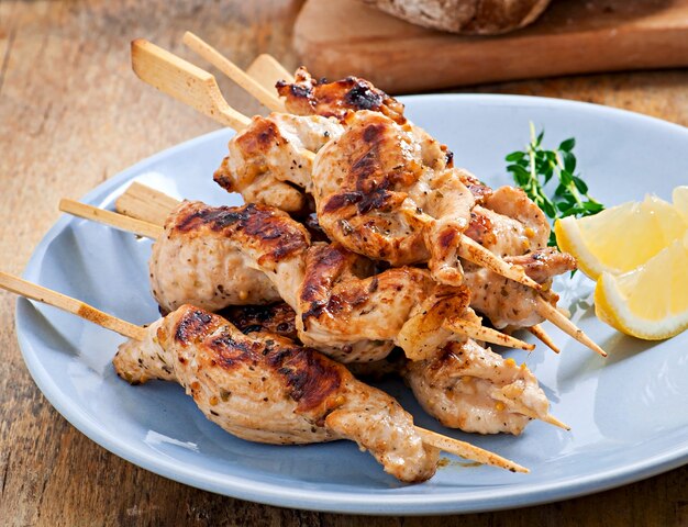 grilled chicken on bamboo skewers