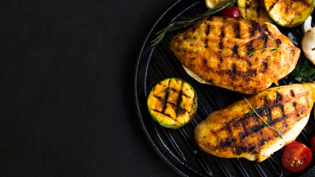 Grilled chicken breasts with vegetables