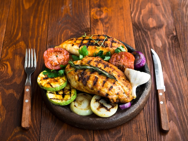 Grilled chicken breasts with vegetables