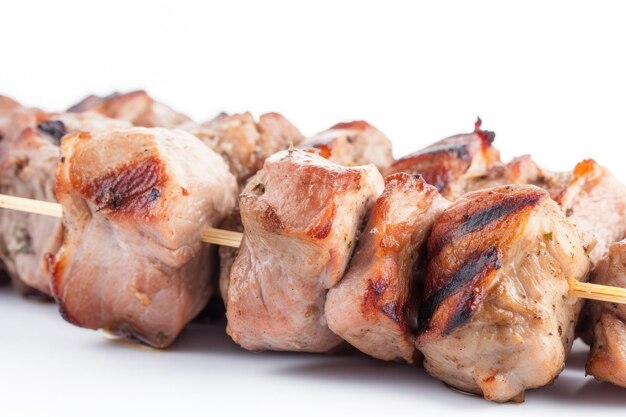 Grilled chicken meat skewer isolated on white background Ai generative