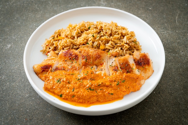 Grilled chicken steak with red curry sauce and rice - muslim food style