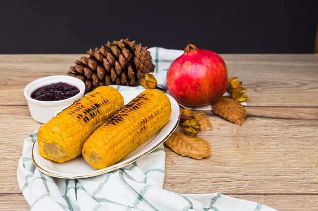 Grilled corns on wooden table 