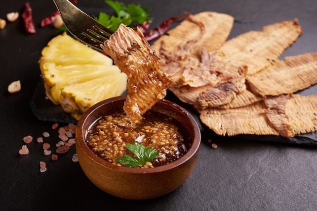 Grilled dried squid with sweet and sour sauce