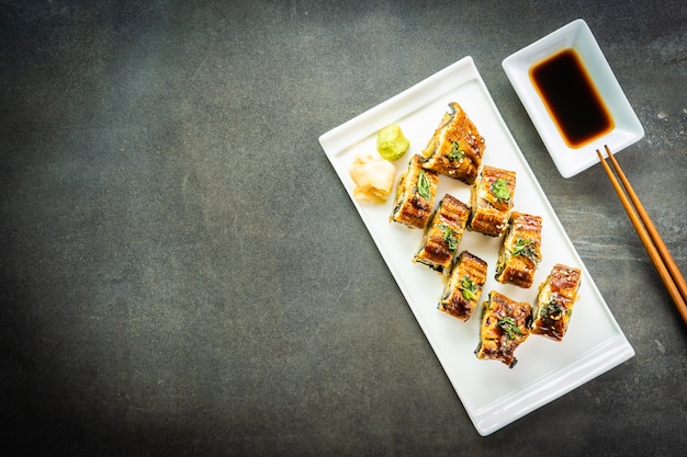 Grilled eel or unagi fish sushi maki roll with sweet sauce