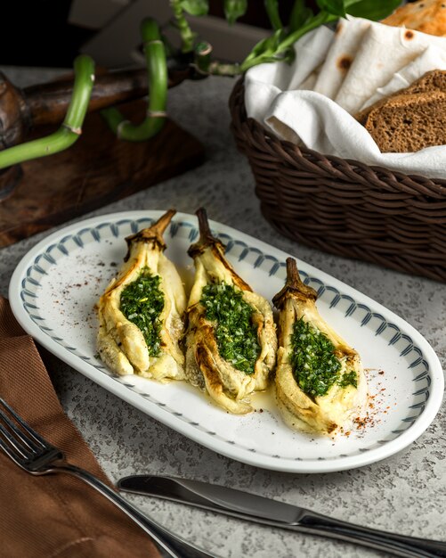 Grilled eggplant with chopped herbs inside