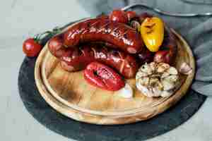 Free photo grilled food on wooden board