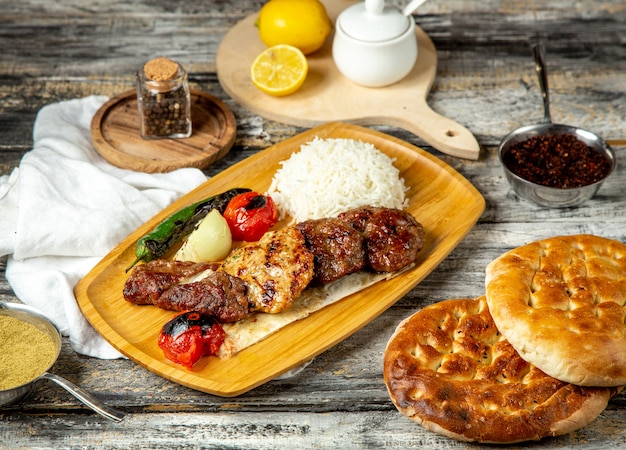 Grilled meat  with rice  pepper  tomato  side  view