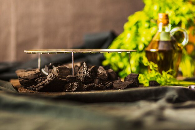 Grilled metal sheet over the coal on table