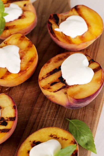 Grilled peaches with whipped cream