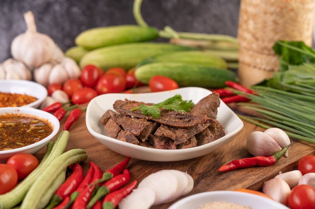 Grilled pork liver in a white plate.