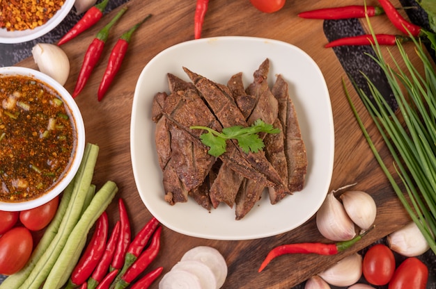 Free photo grilled pork liver in a white plate.