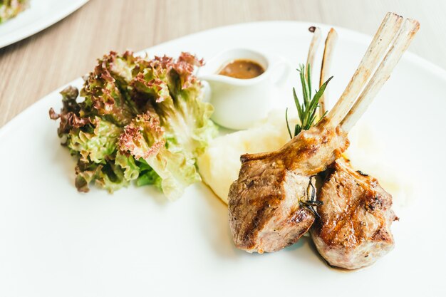 Grilled rack of lamb meat with sauce