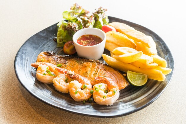 Grilled salmon and prawn steak