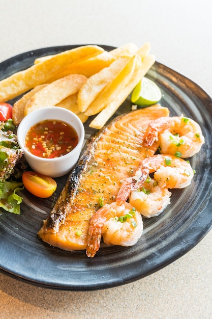 Grilled salmon and prawn steak