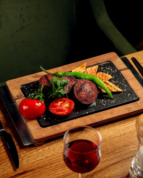 Grilled sausage with bread grilled pepper and tomato