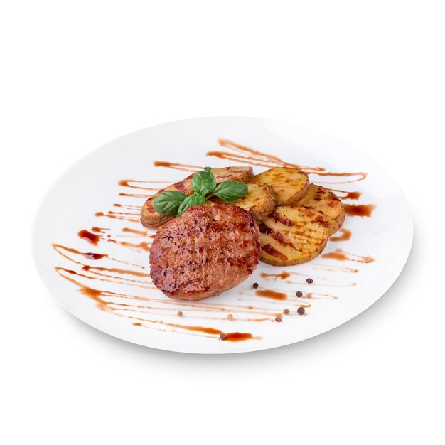 Grilled steak, baked potatoes, green basil and sauce on white plate. Isolated on white background. Photo for the menu