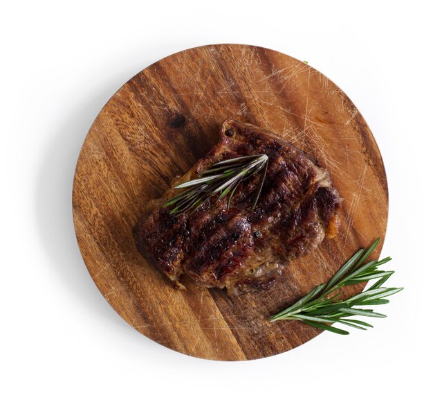 Grilled steak on table