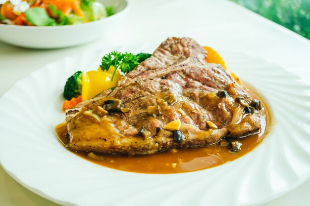 Grilled t-bone beef meat steak with vegetable