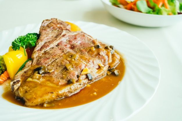 Grilled t-bone beef meat steak with vegetable