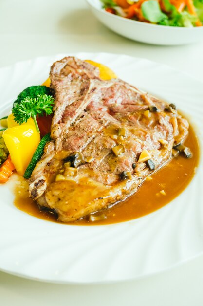 Grilled t-bone beef meat steak with vegetable