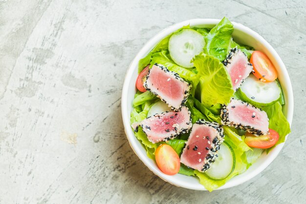 Grilled tuna salad in white bowl - healthy food