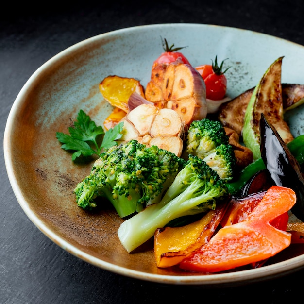 Grilled vegetables salad with broccoli and parsley