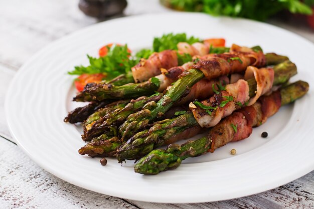 Grilled violet asparagus wrapped with bacon