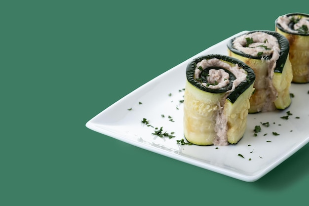 Grilled zucchini rolls stuffed with cream cheese and tuna