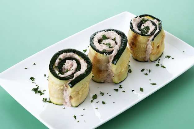 Grilled zucchini rolls stuffed with cream cheese and tuna