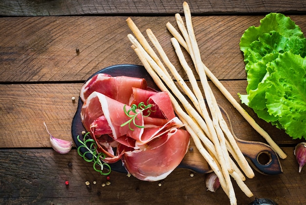 Grissini bread sticks with prosciutto